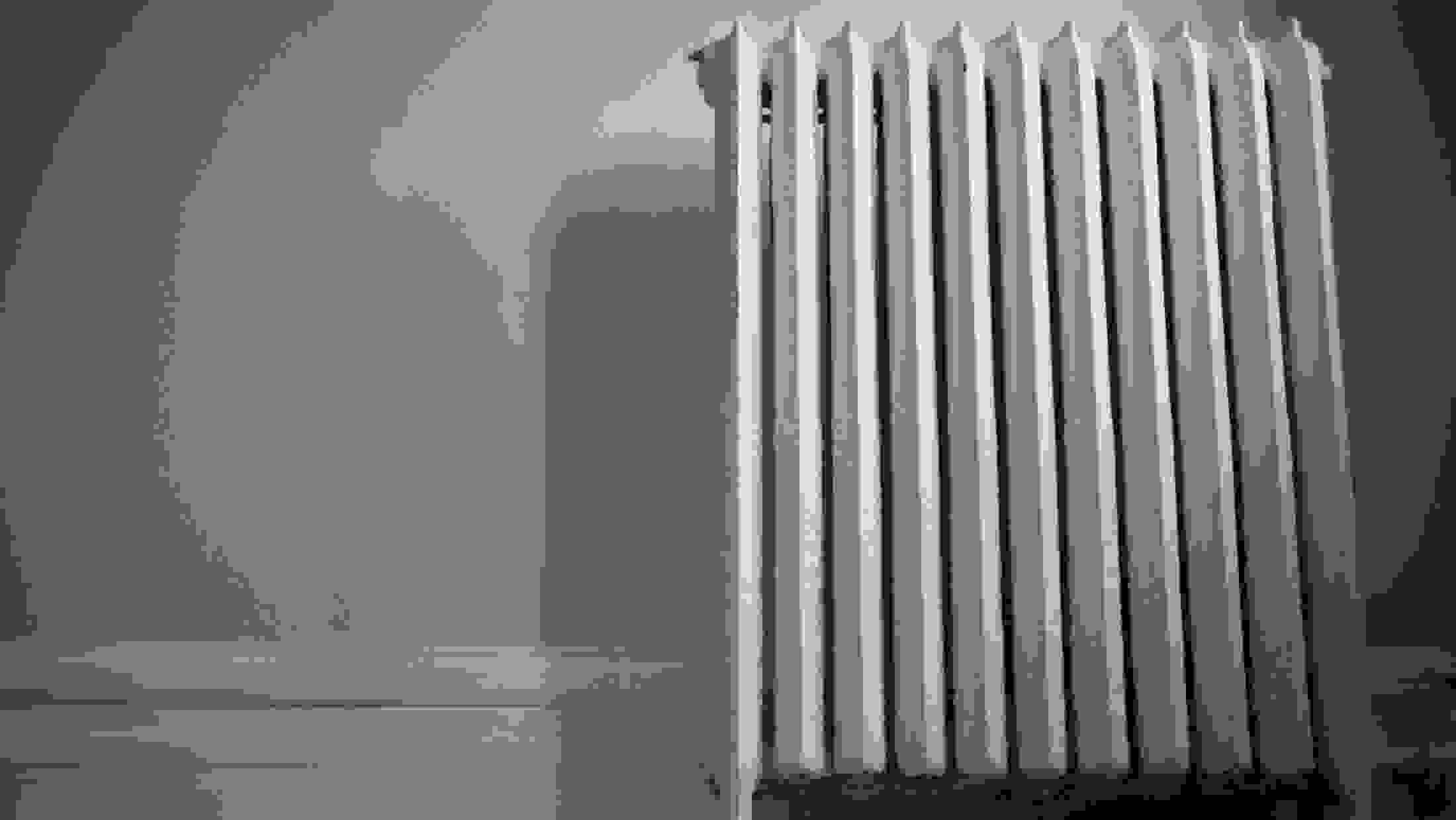 Old cast iron radiator at surface level