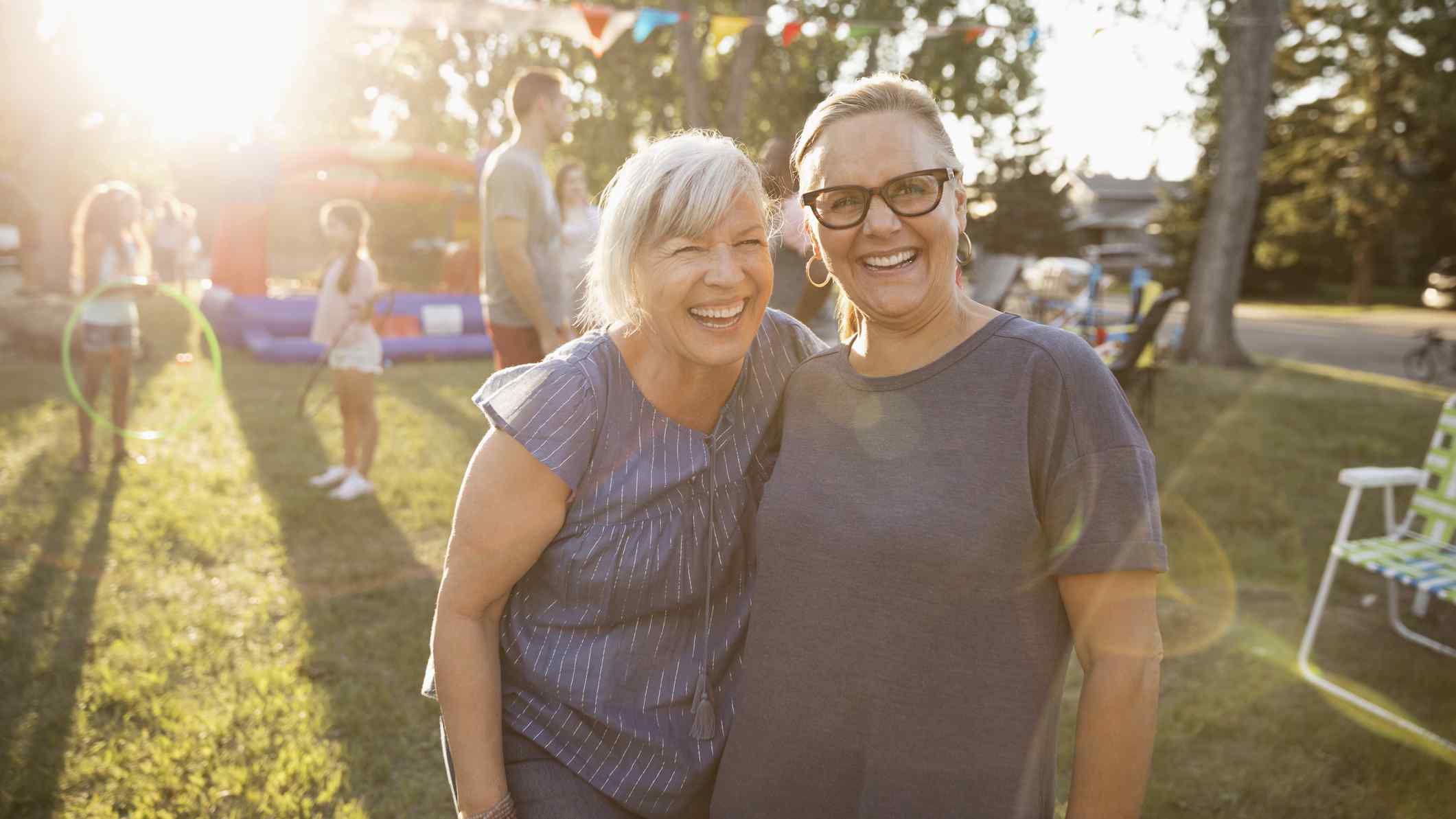 Two women smiling at garden party