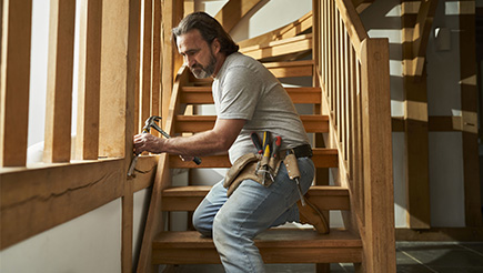 Tradesman and AXA Customer, Steve Follard, completing woodwork