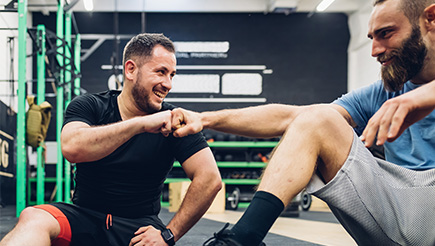 A personal trainer working with their client