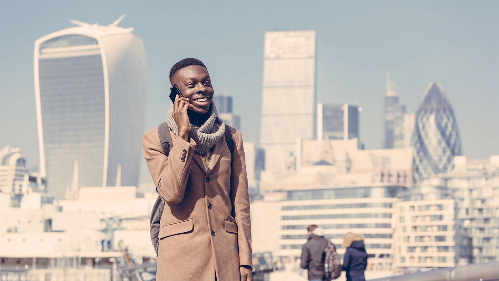 A man talking on phone in London city