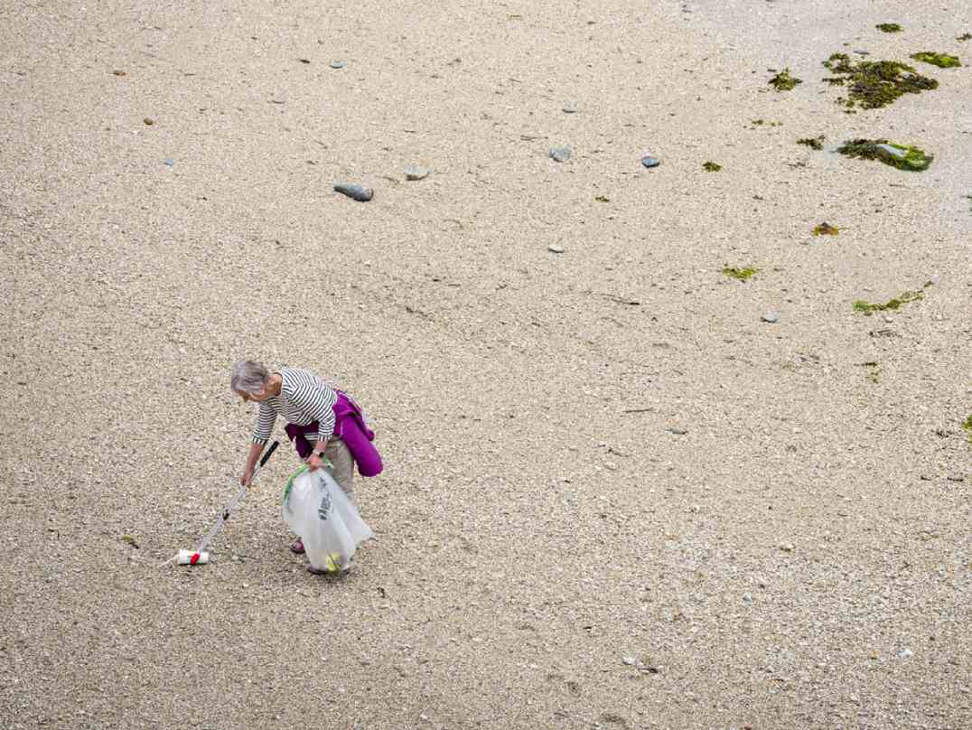 Aerial shot of Action Nan collecting litter on beach.jpg