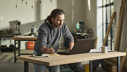 Steve, AXA Customer and tradesman, hard at work calculating his allowable expenses.