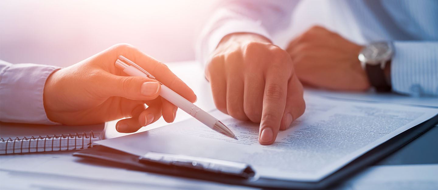 A person filling out some paperwork