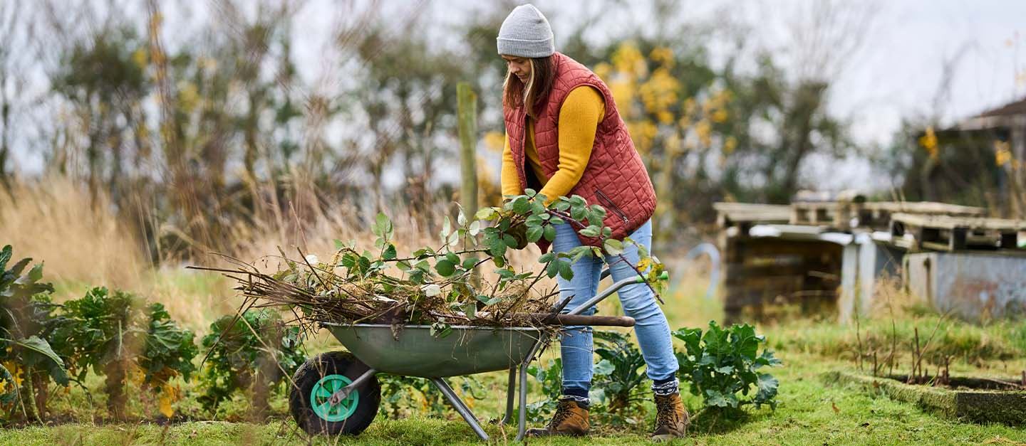 AXA Customer, Bryony, working in her garden business