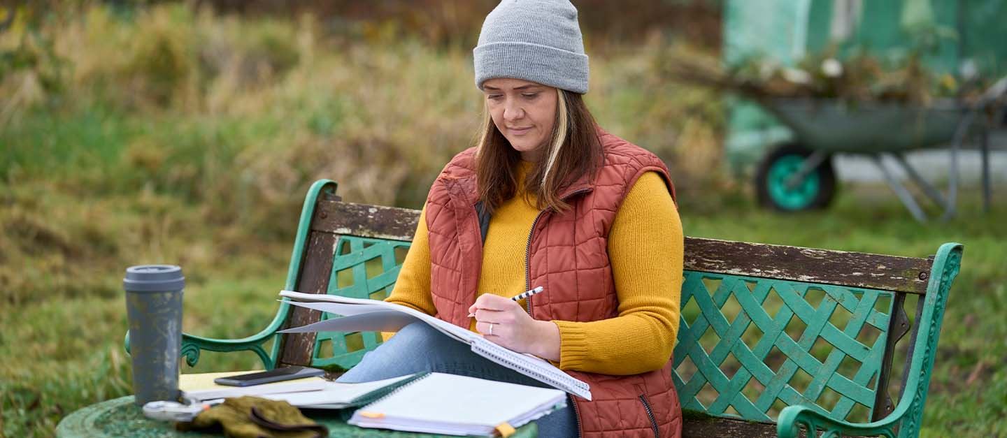 Gardener Bryony Mole working on some paperwork