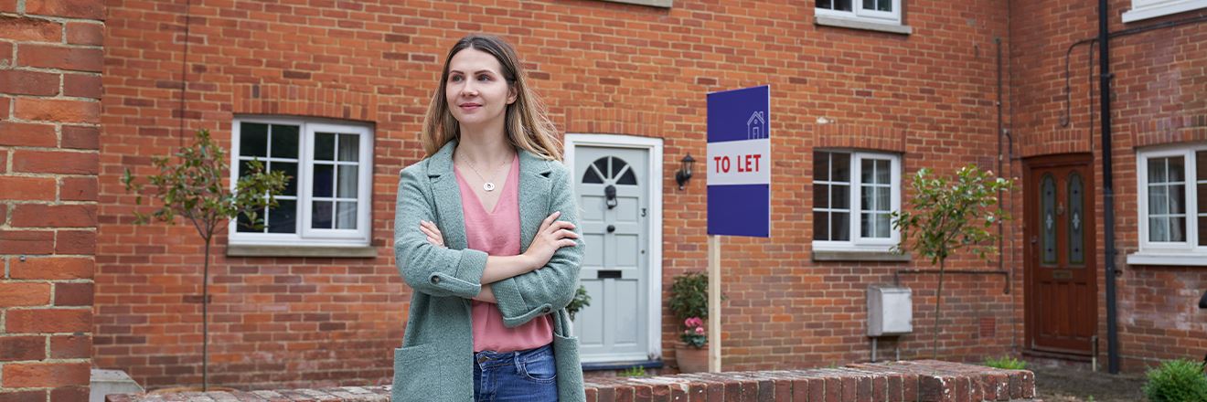 women-outside-house-with-to-let-sign