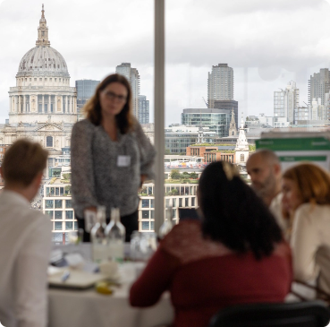 Daphne chairing a meeting
