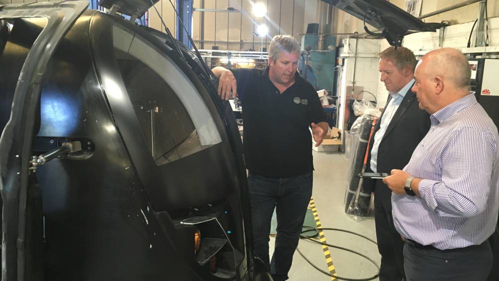 AXA's Doug Jenkins and David Williams get a tour of a Capri pod with Julien Turner from Westfield
