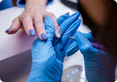 technician painting a clients nail