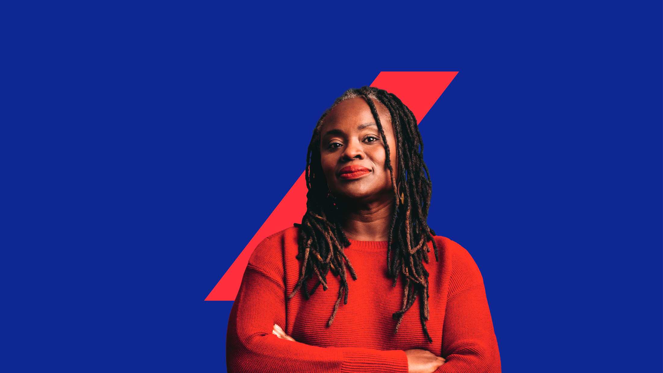 Black woman looking at the camera while standing against a blue background featuring the AXA switch