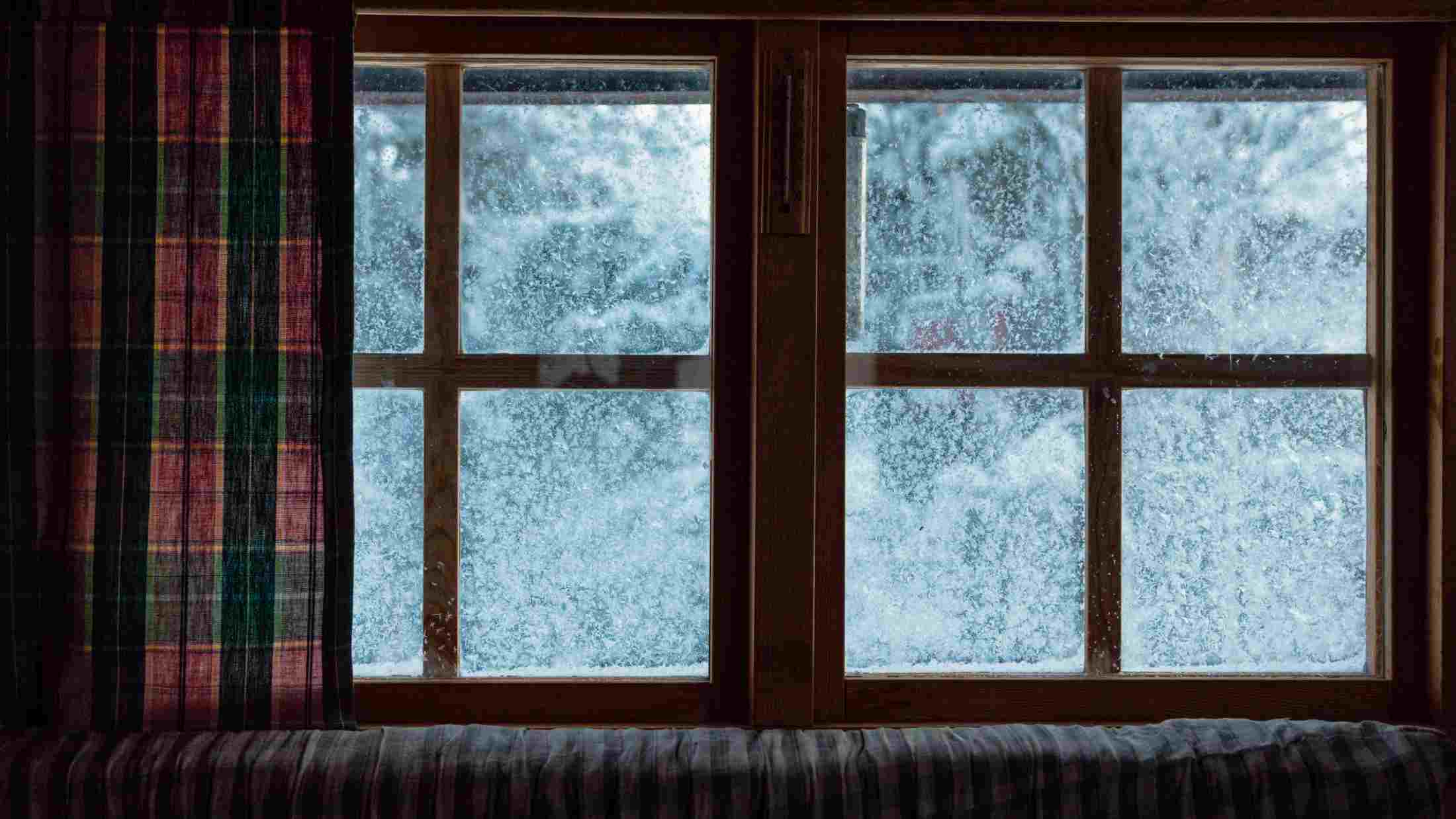 Closeup of frozen window at home