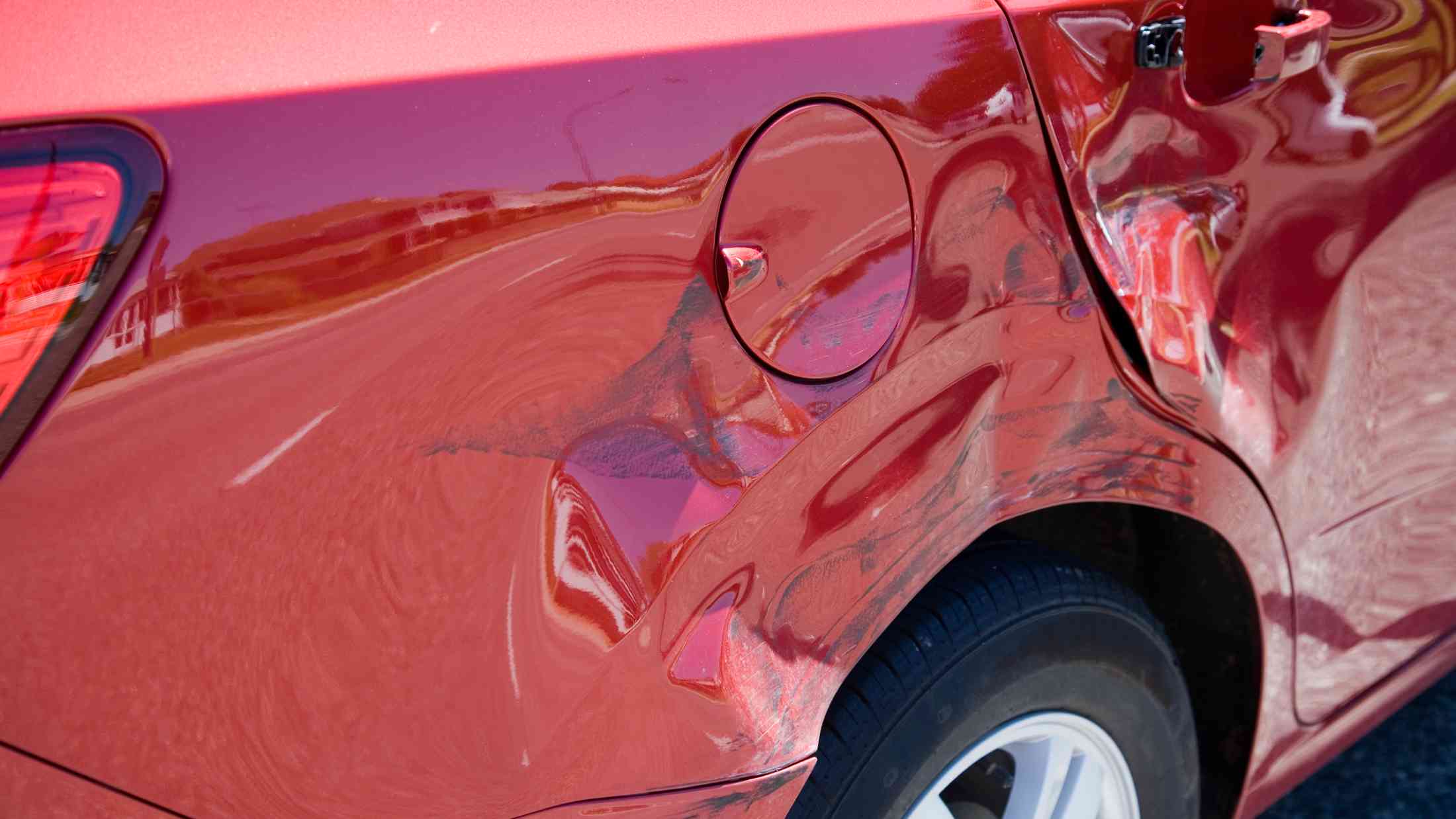 Damage to rear of a red car