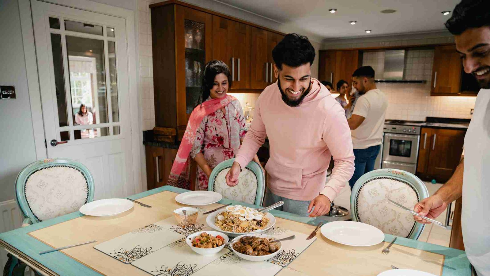 Family working together to set the table for a family feast