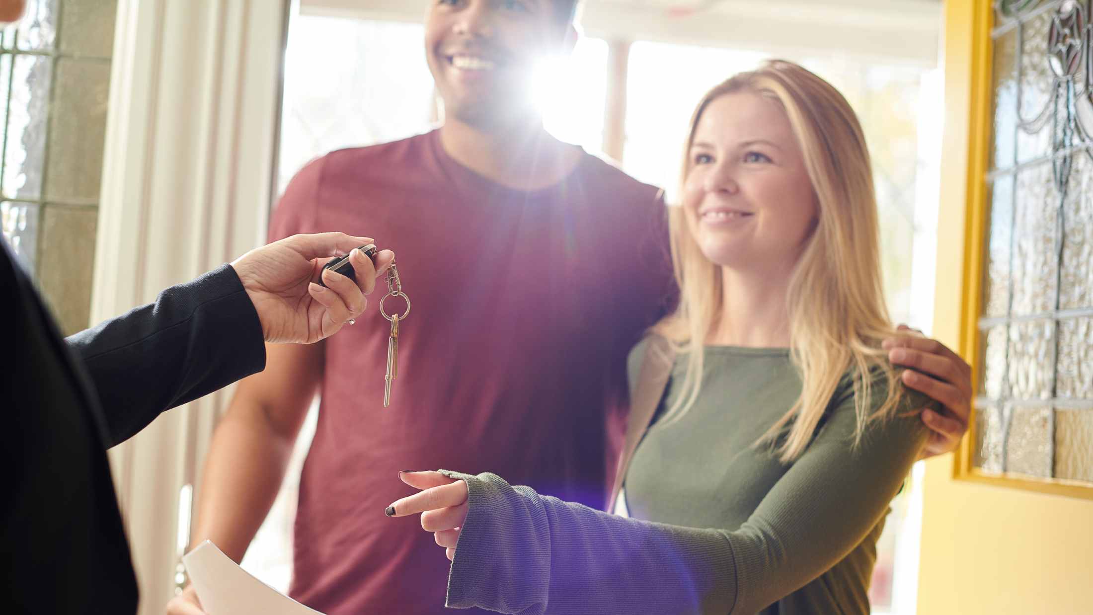 House hunting couple get the keys