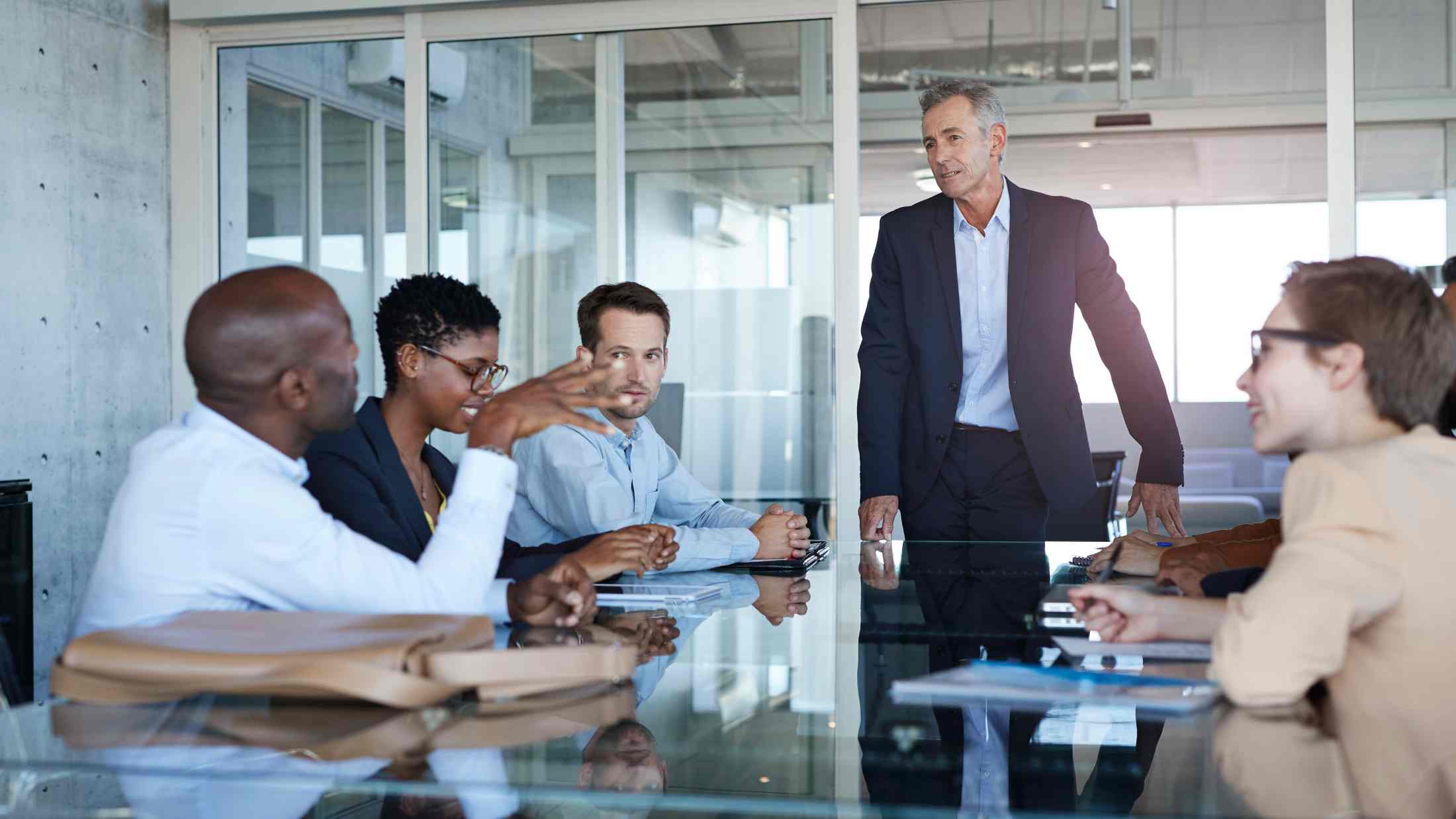 Male CEO presenting plan in meeting room