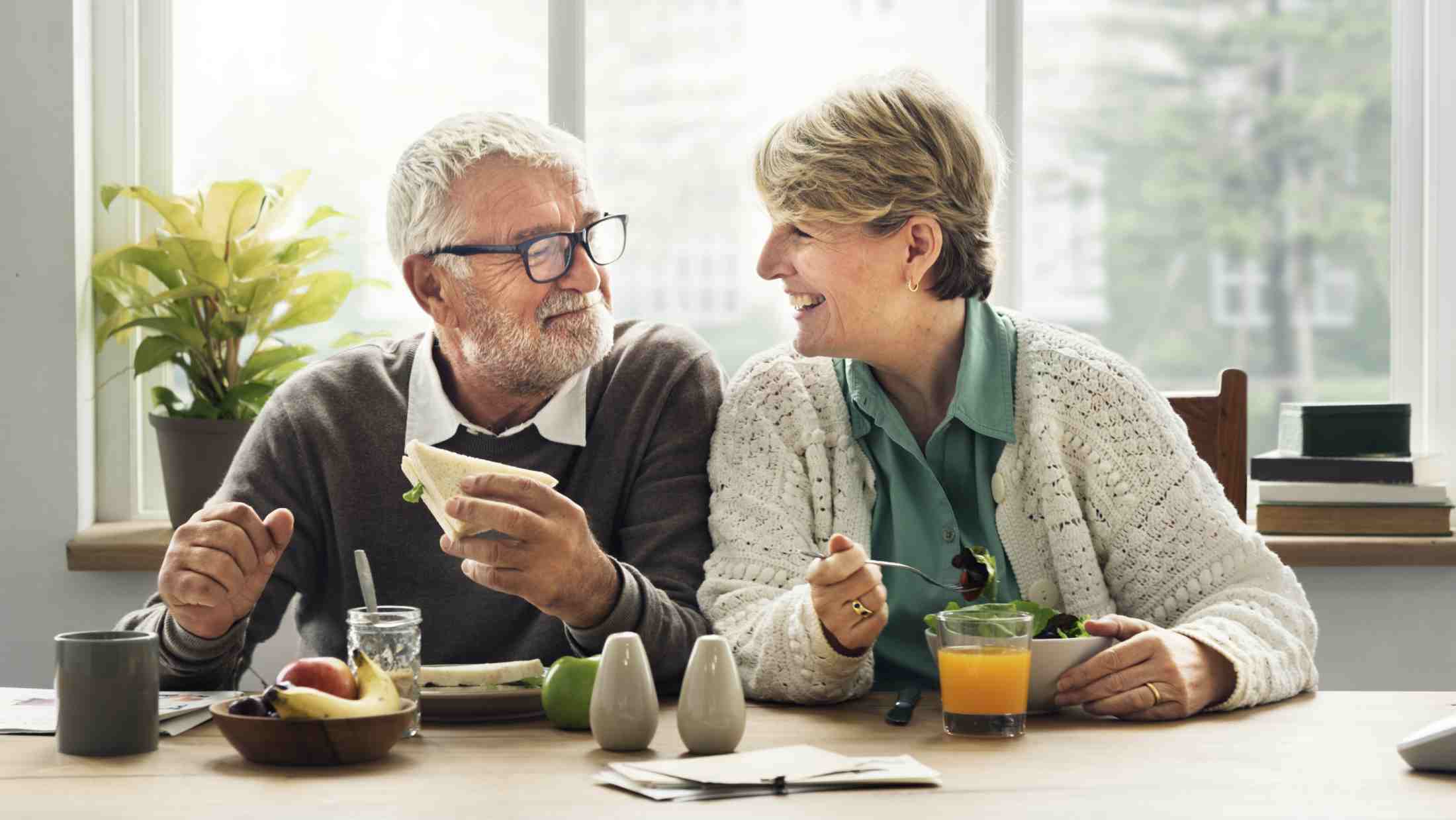 Senior couple having a breakfast in their kitchen