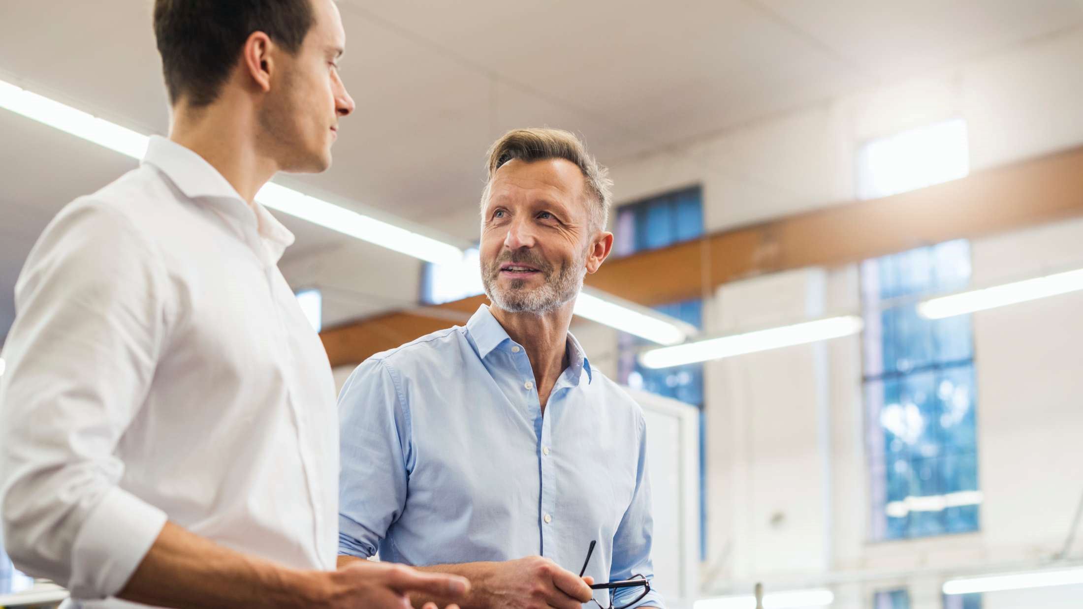 Two businessmen discussing in factory