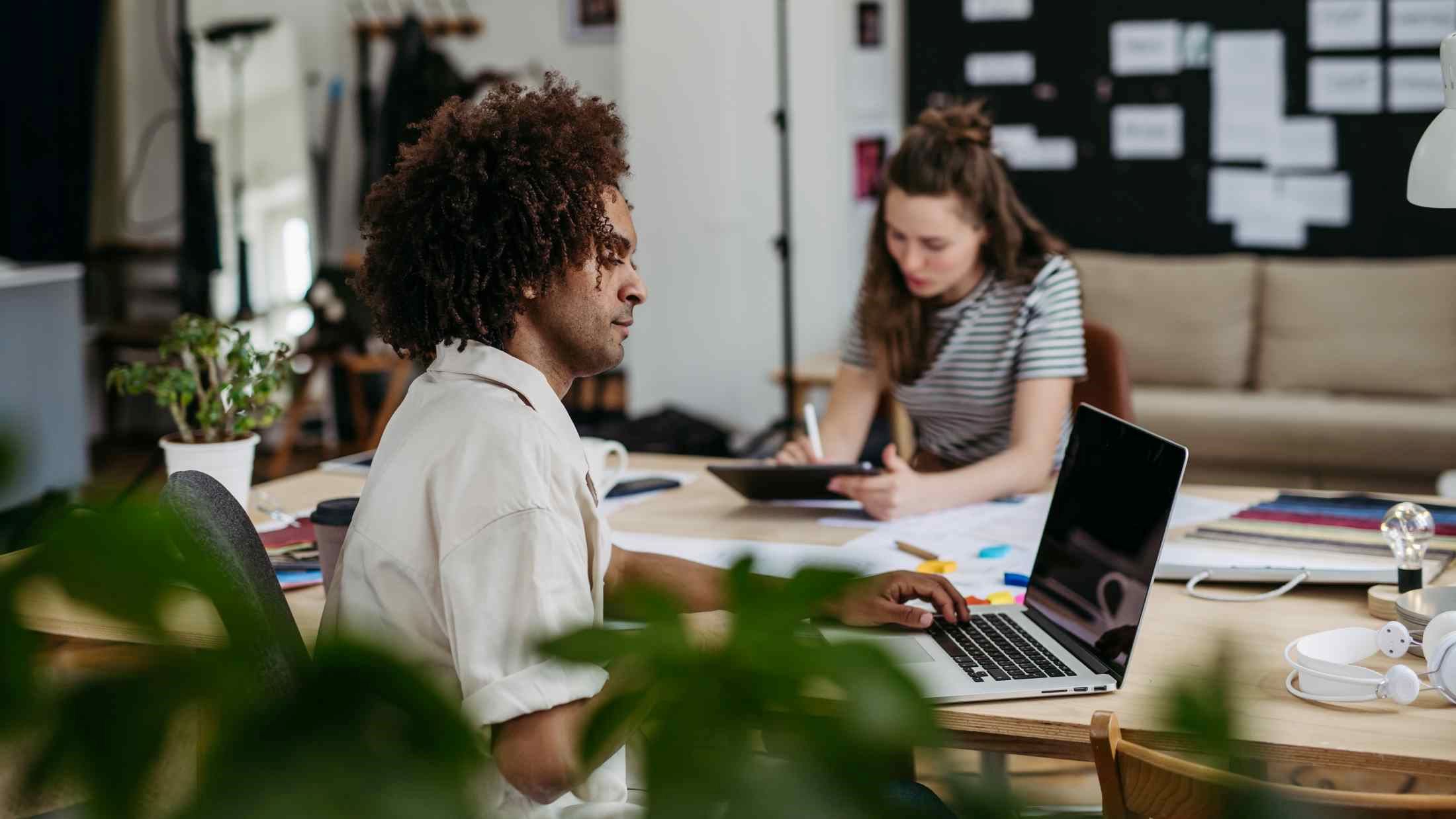 Young colleagues working together in startup company
