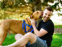 Man sitting with his dog, showing love for animals