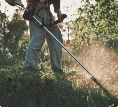 Man strimming grass