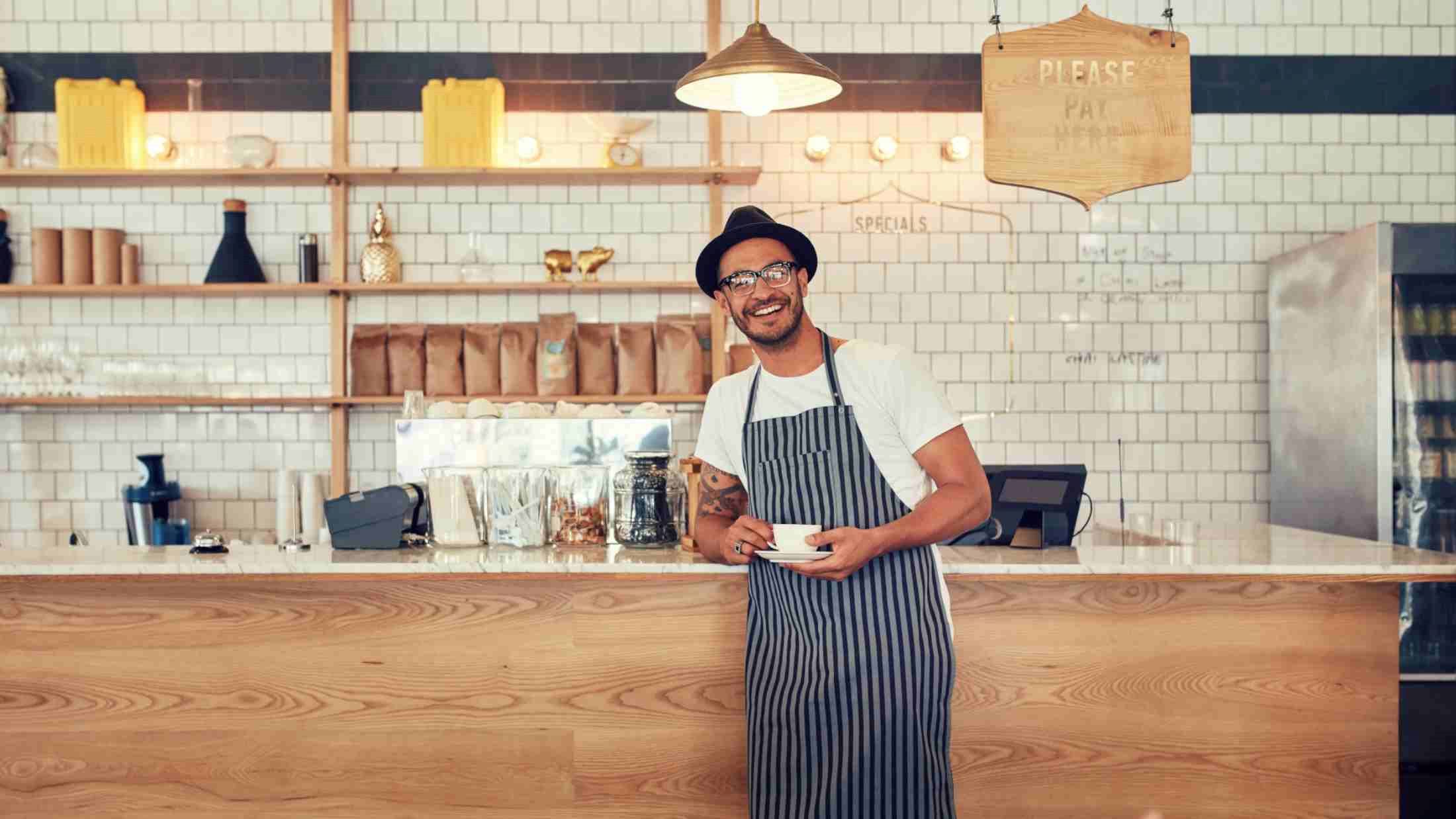 A man working in his coffee shop