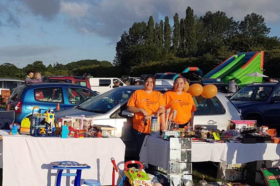 AXA staff fundraising at a car bootsale