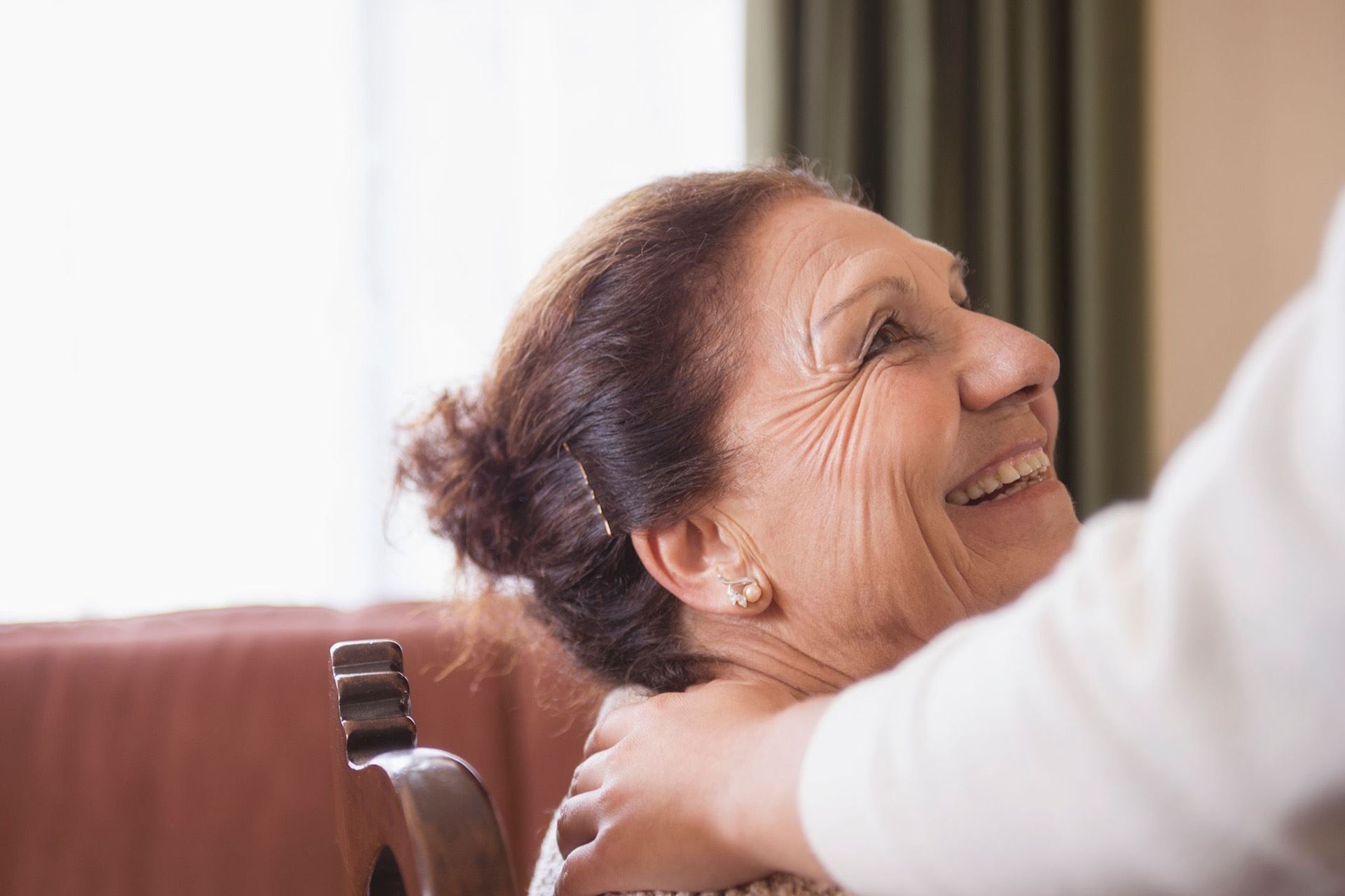 a woman smiles at her helper