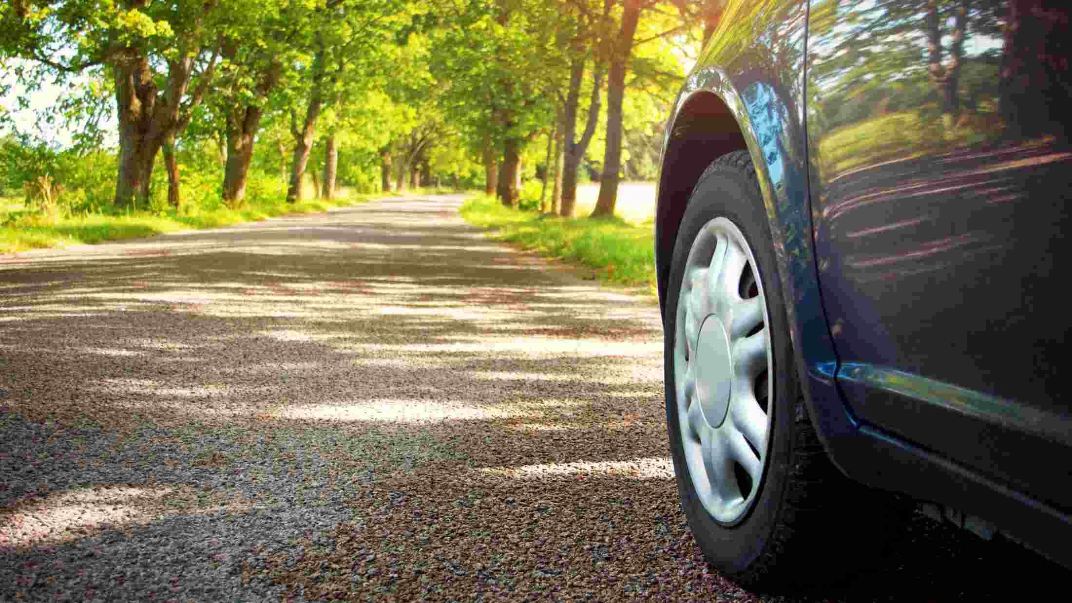 A car driving forwards in a country road