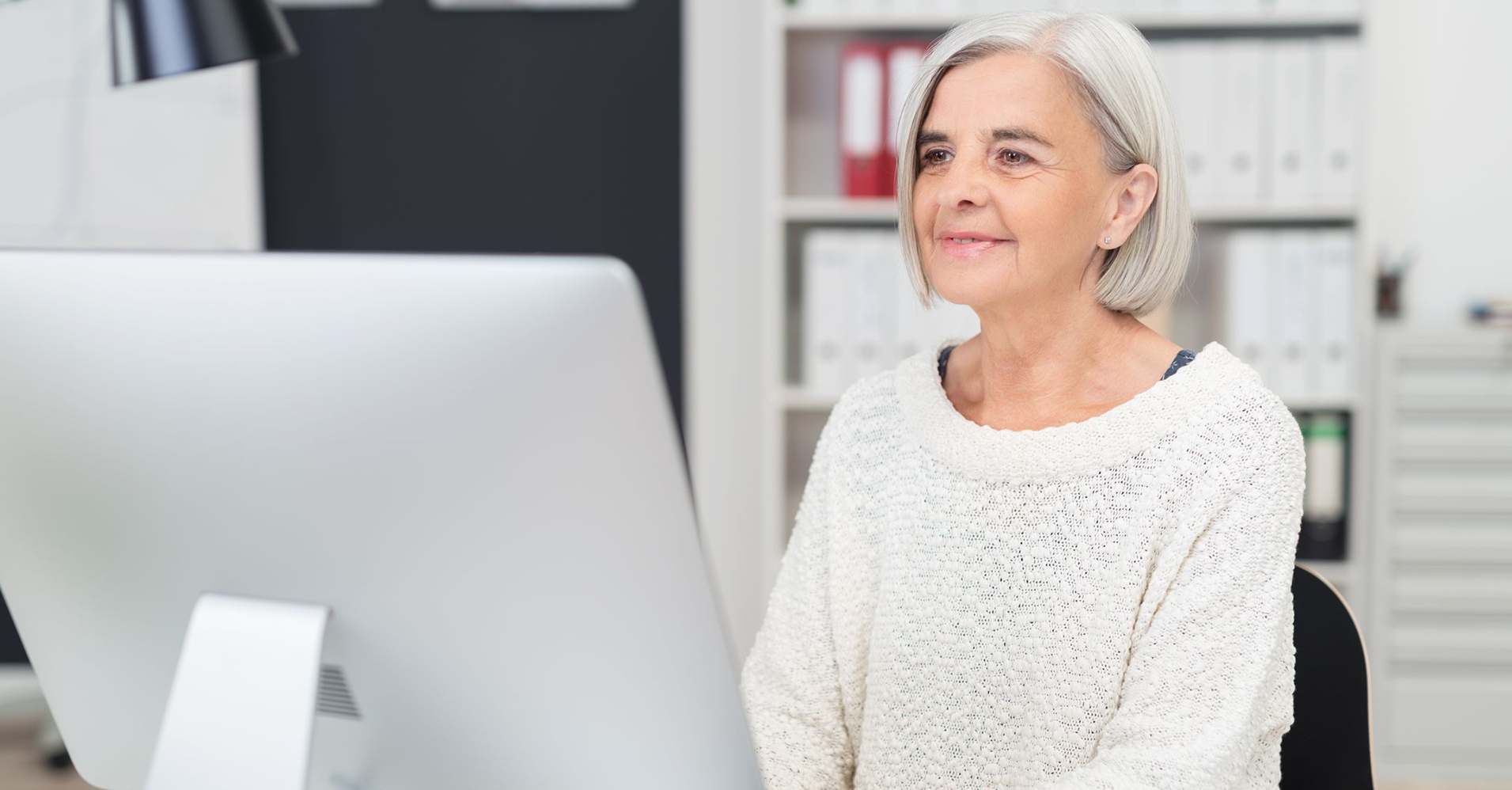 Woman working on an iMac