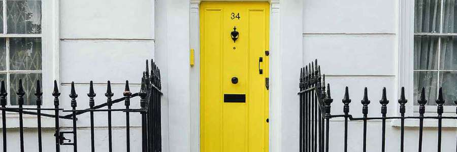 Yellow front door of terraced house