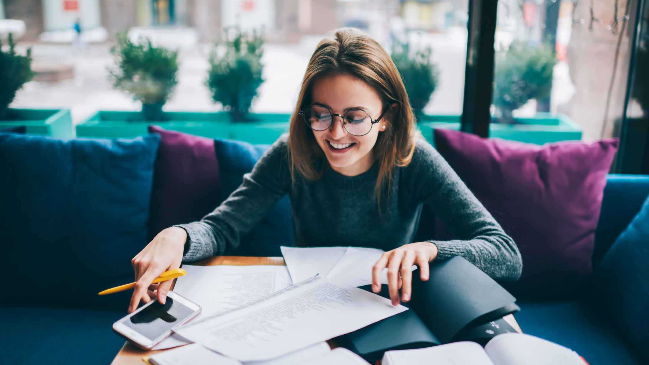 Young female sat down studying