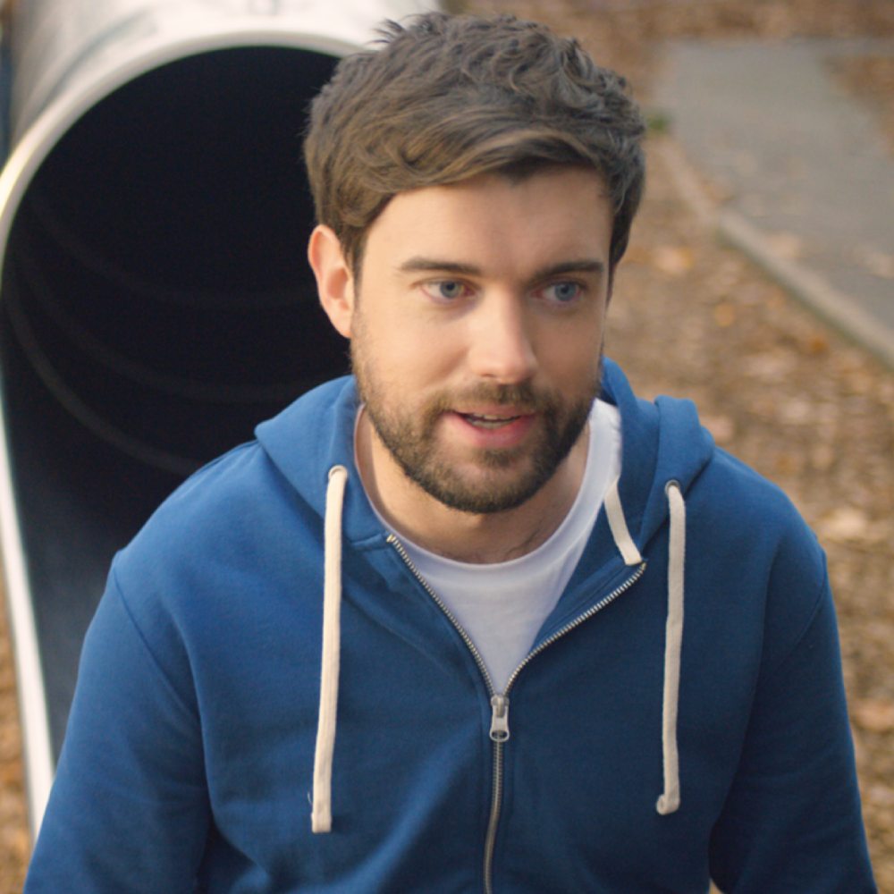 Jack Whitehall at the foot of a play slide