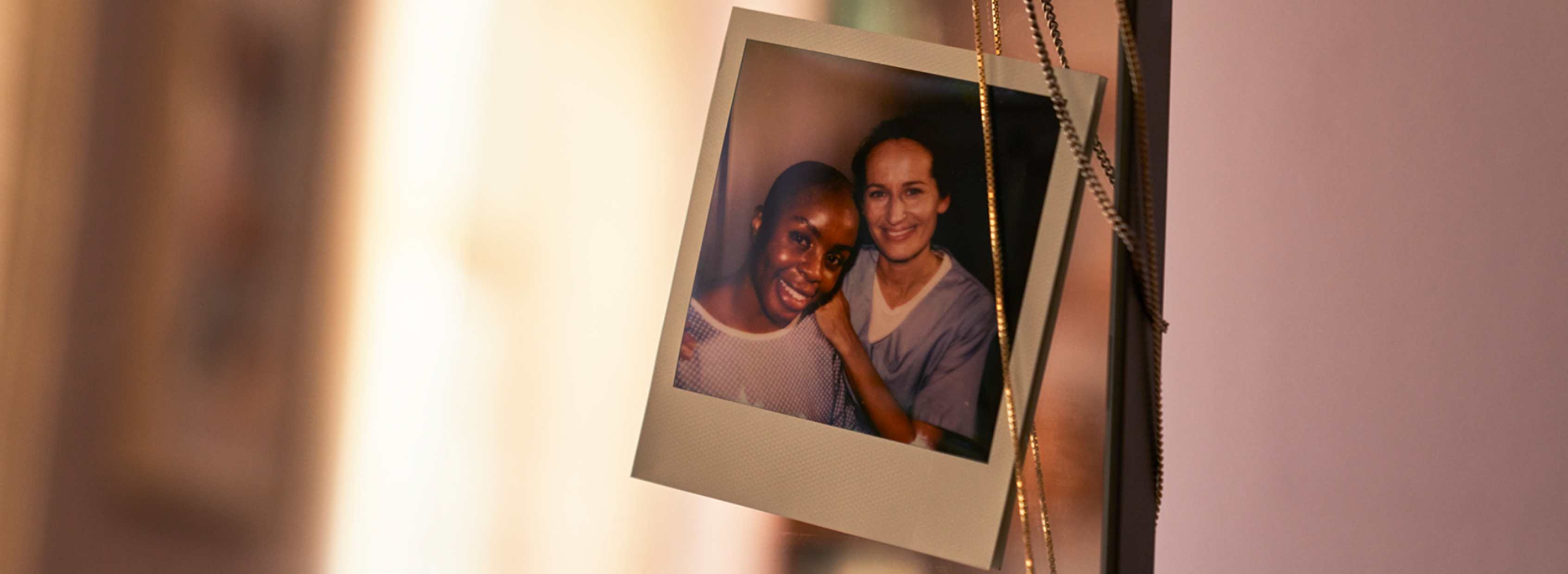 photo of a patient and a nurse attached on a mirror