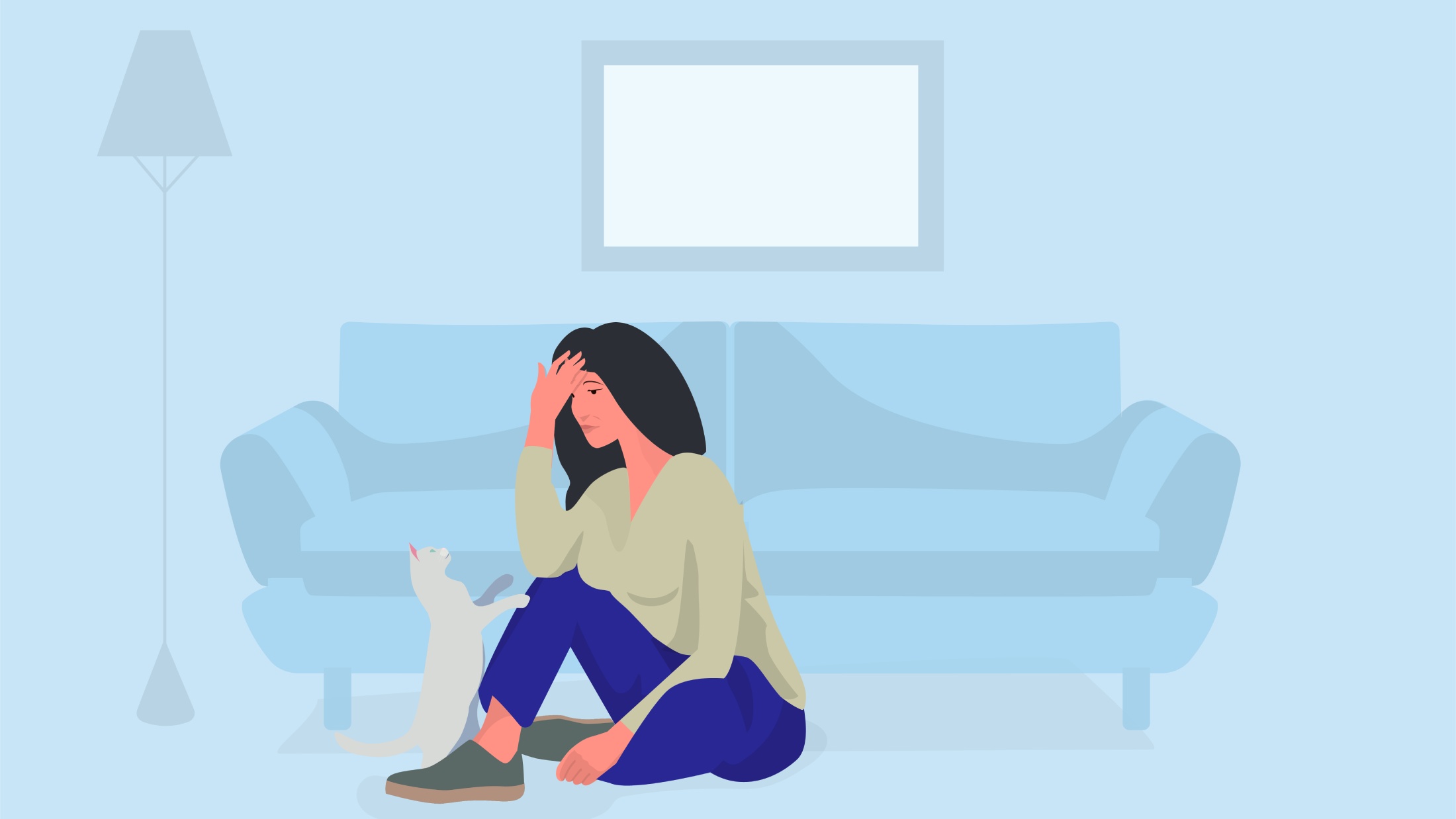 Worried woman sitting on floor with a cat at home