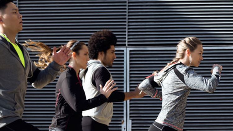 Group of people running in the city