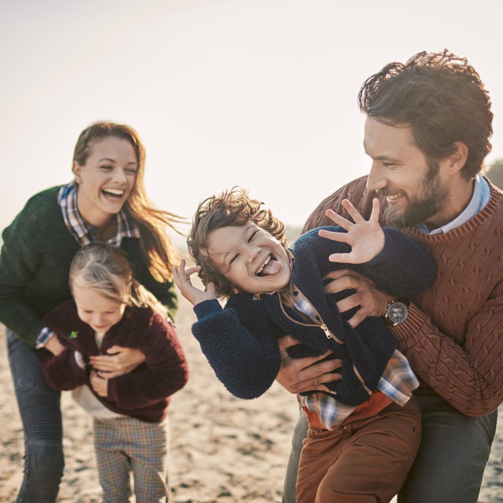 Close up of a happy family enjoying time on the beach