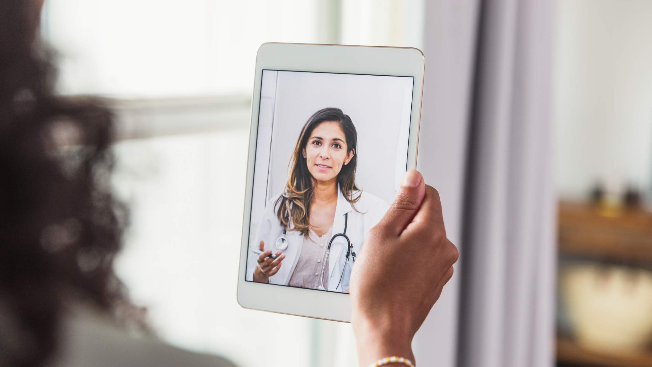 A female doctor during a telemedicine appointment