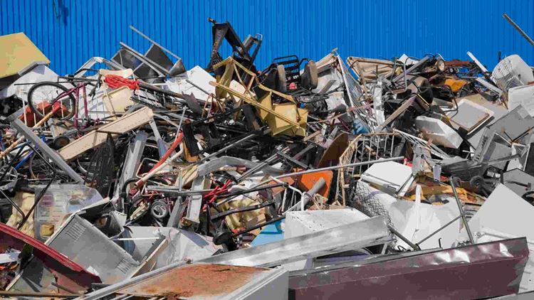 Pile of discarded household and industrial items at a scrap metal recycling centre