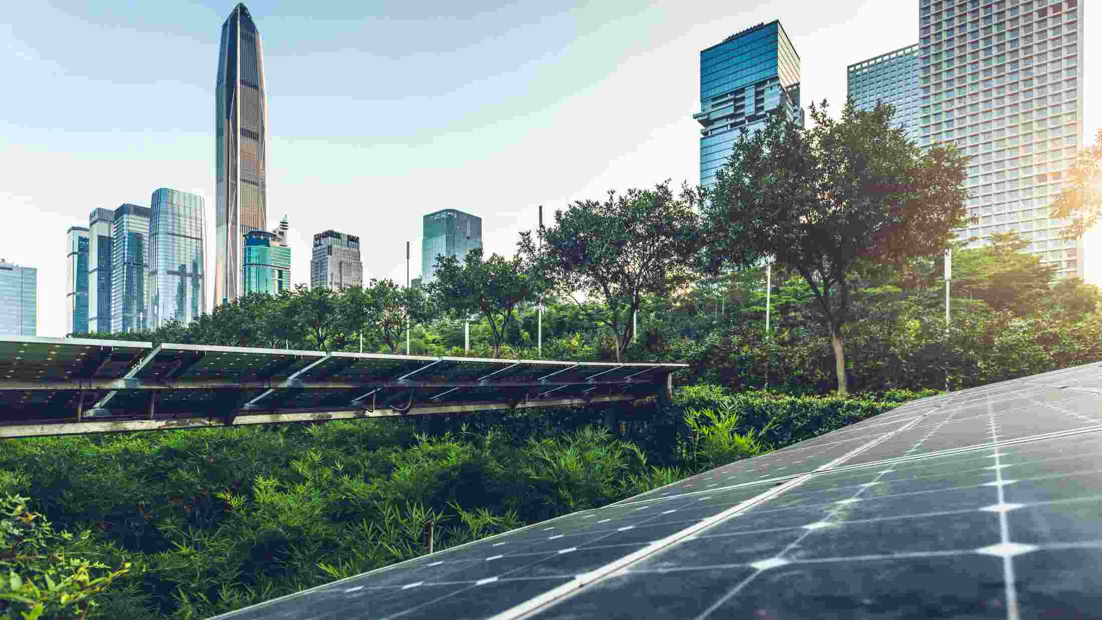 Roof top solar installation with a city downtown skyline view as background
