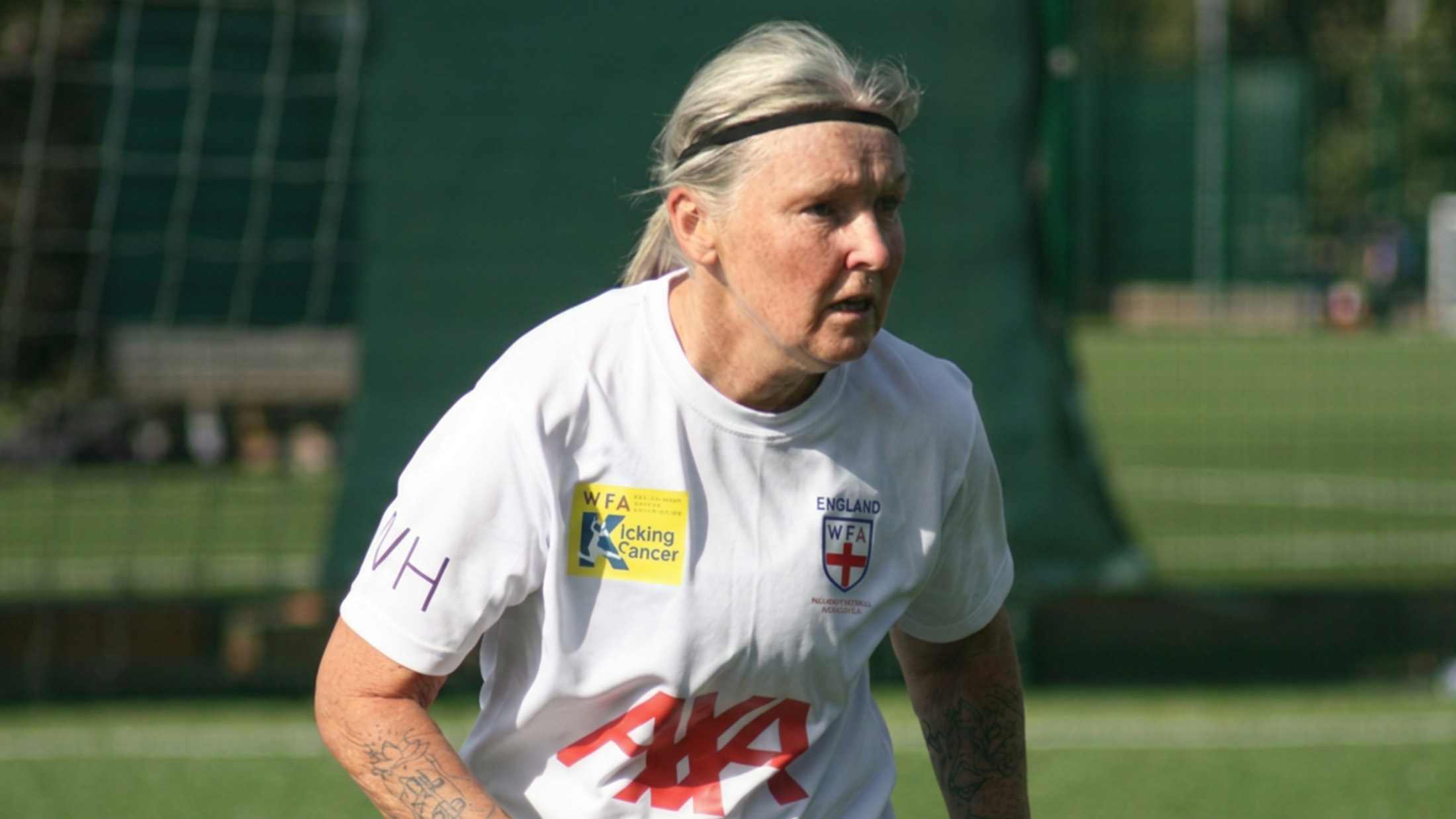 England Women's Walking Football player in action wearing a headband