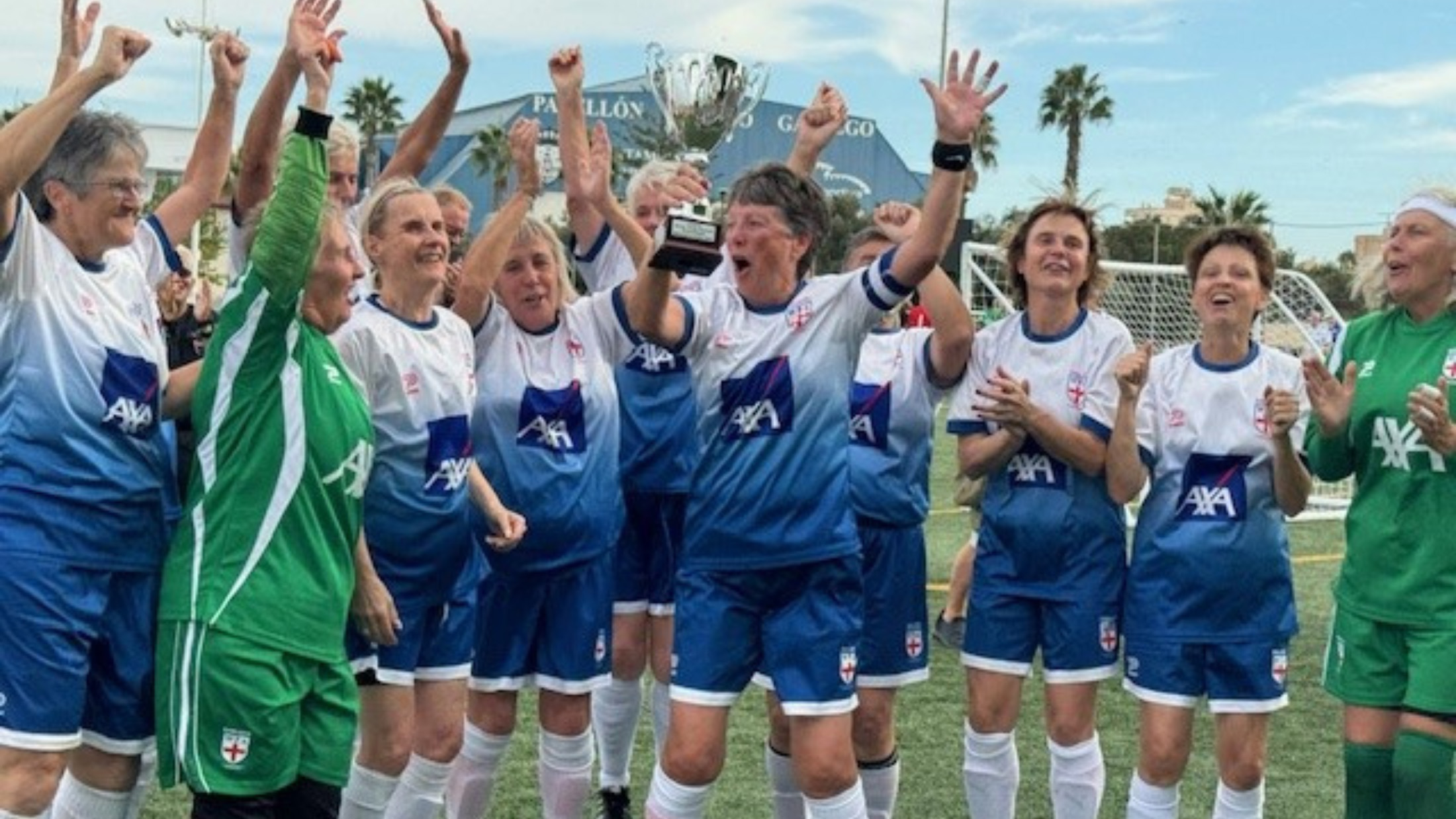 England Women's Walking Football team celebrating lifting the trophy