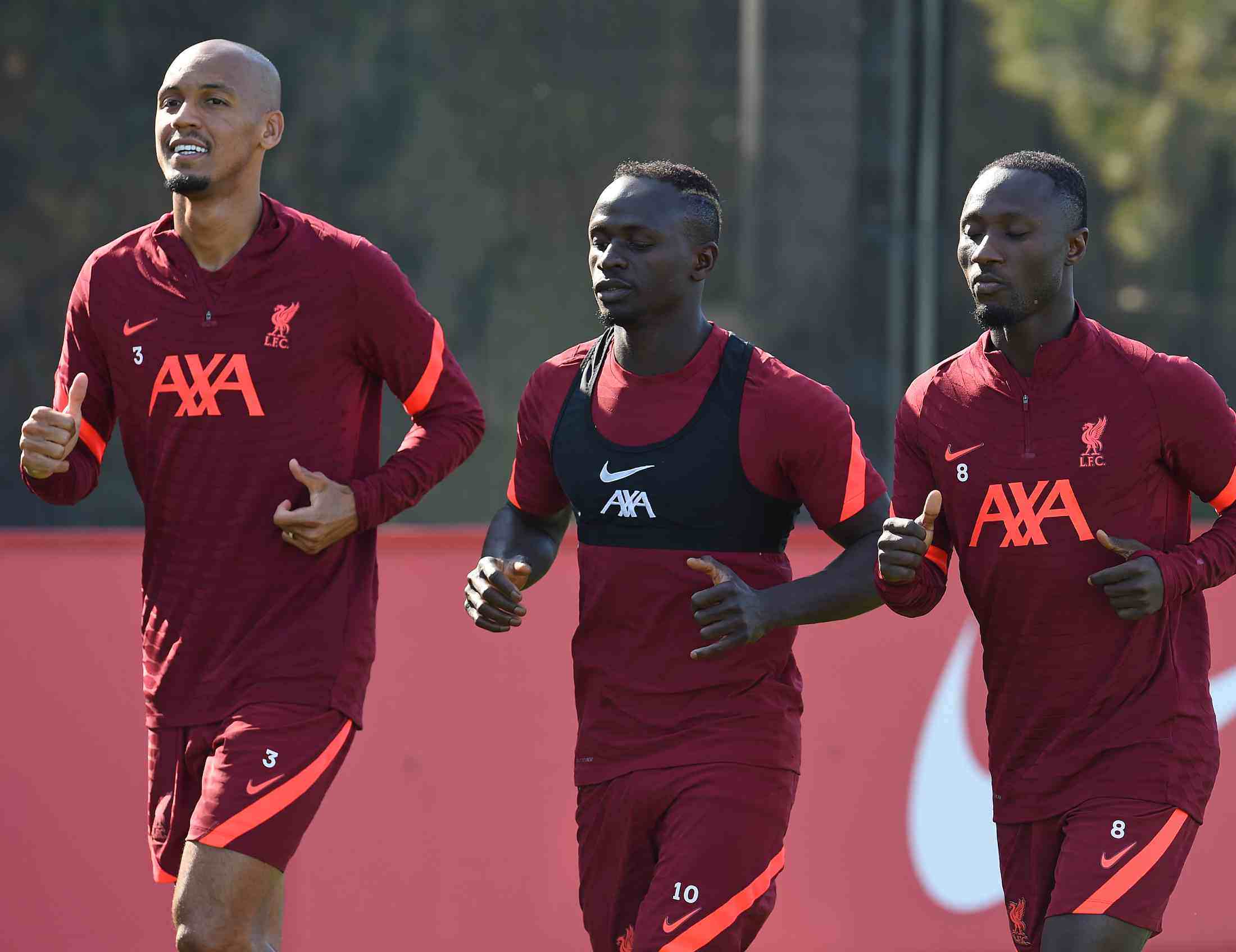 Liverpool Football Club players wearing their AXA sponsored training kit