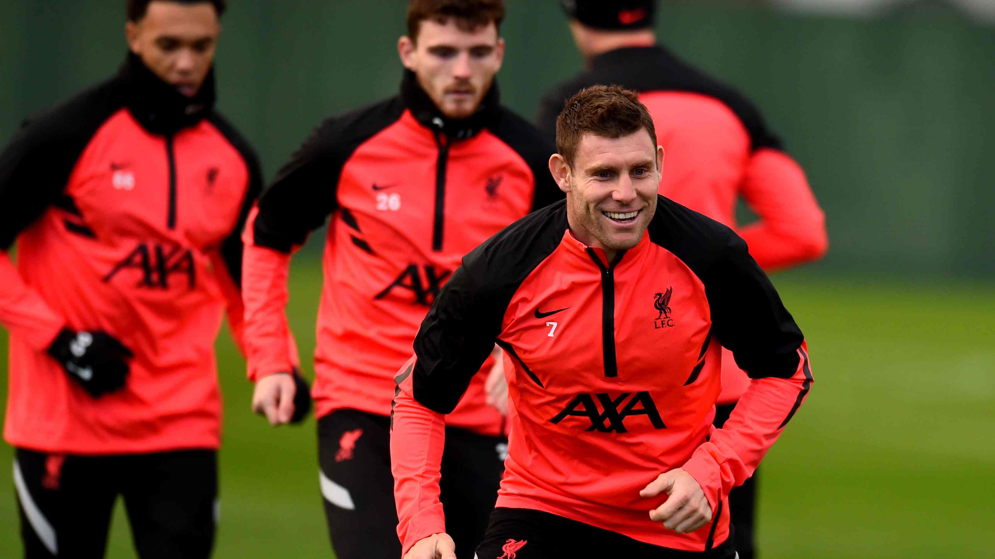 James Milner wearing his AXA sponsored training kit