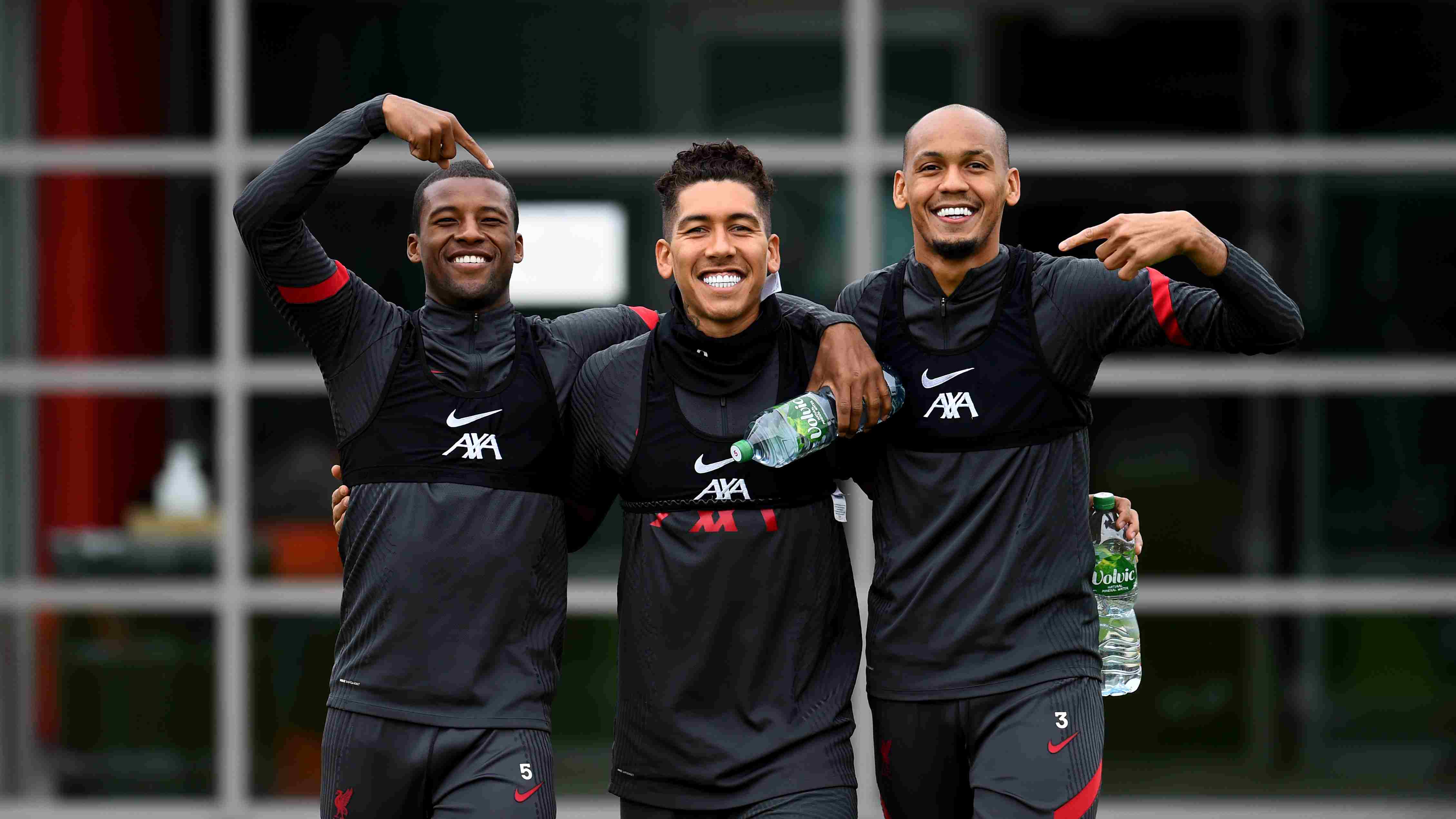 Liverpool Football Club players wearing their AXA sponsored training kit