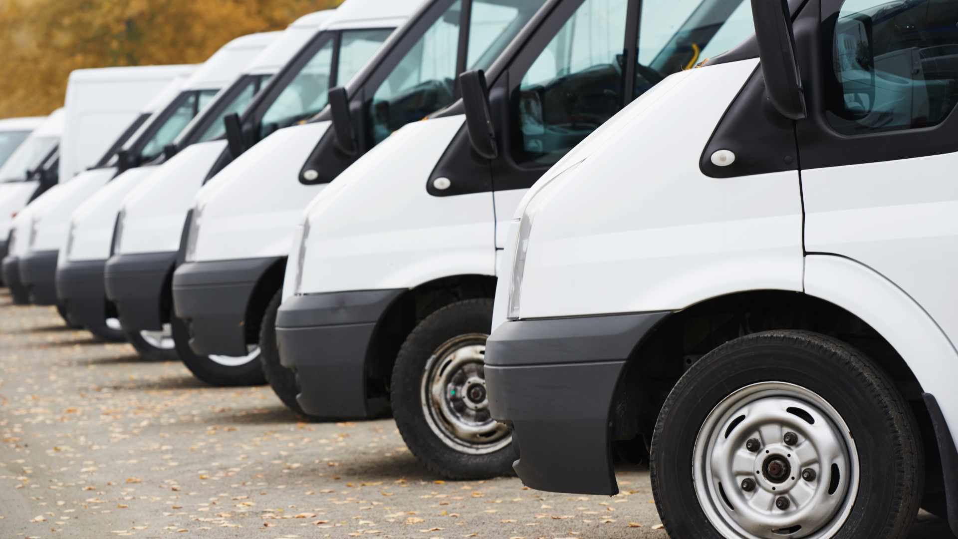 Commercial delivery vans in row at parking place