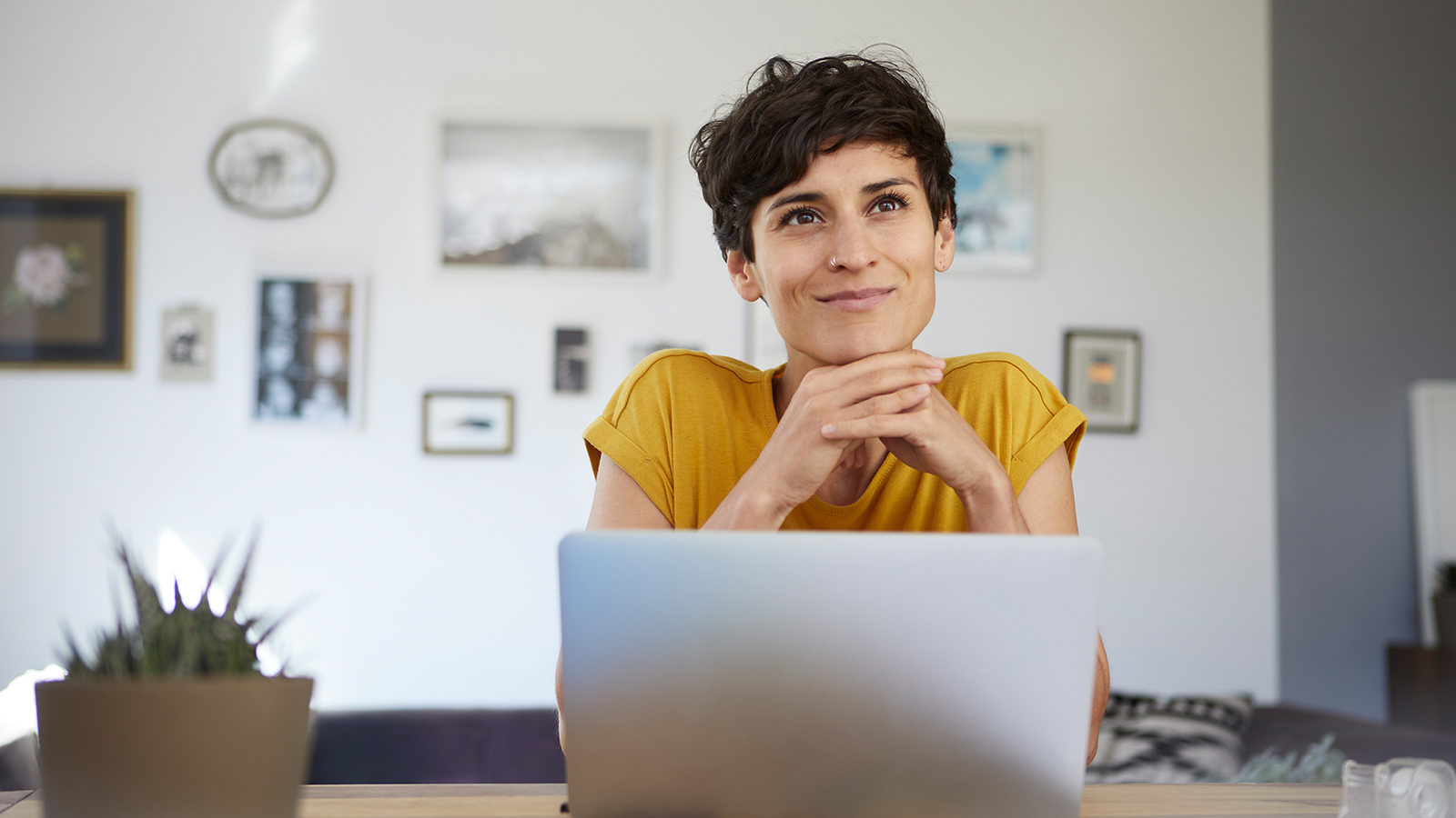 A consultant looks up from her laptop.