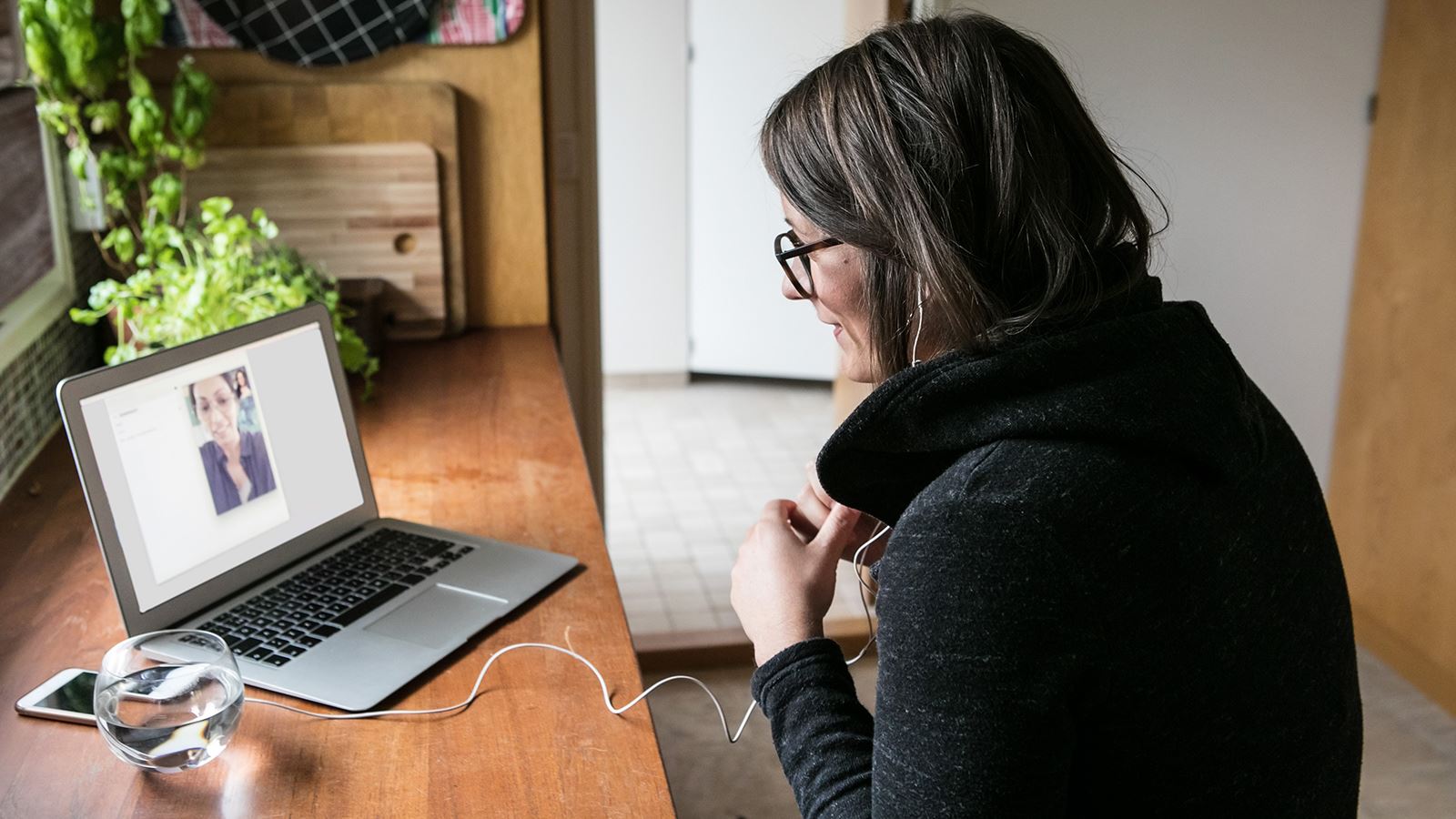 A consultant looks at her laptop.
