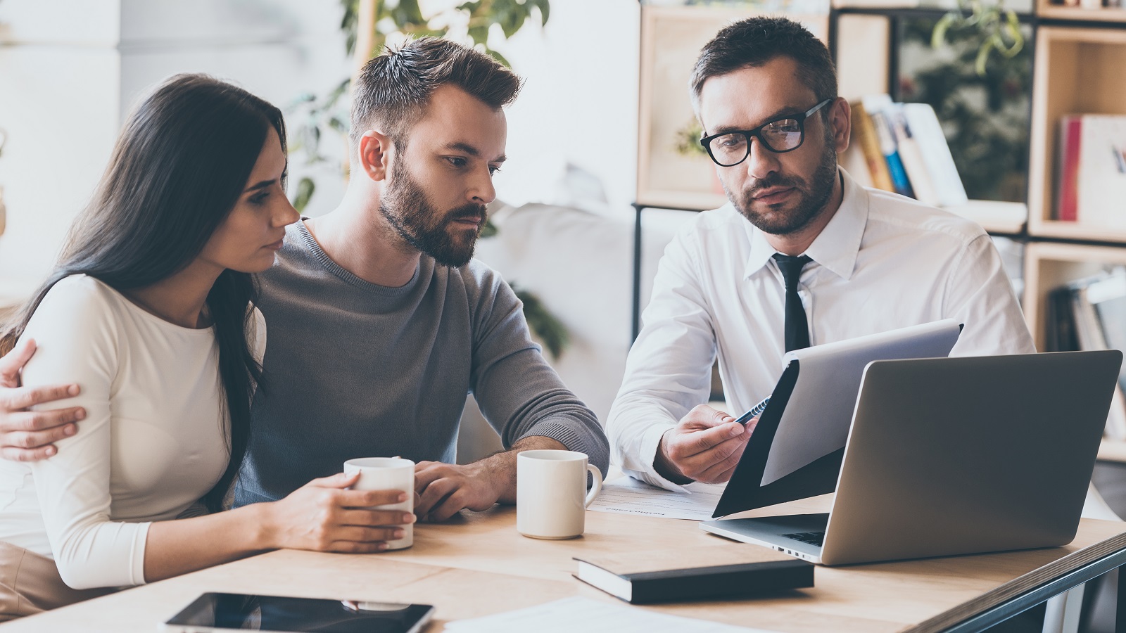 A consultant talking to two clients.