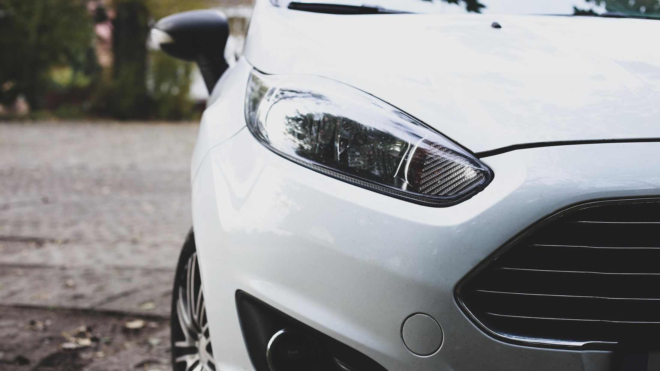 Front view of a Ford Fiesta white hatchback car